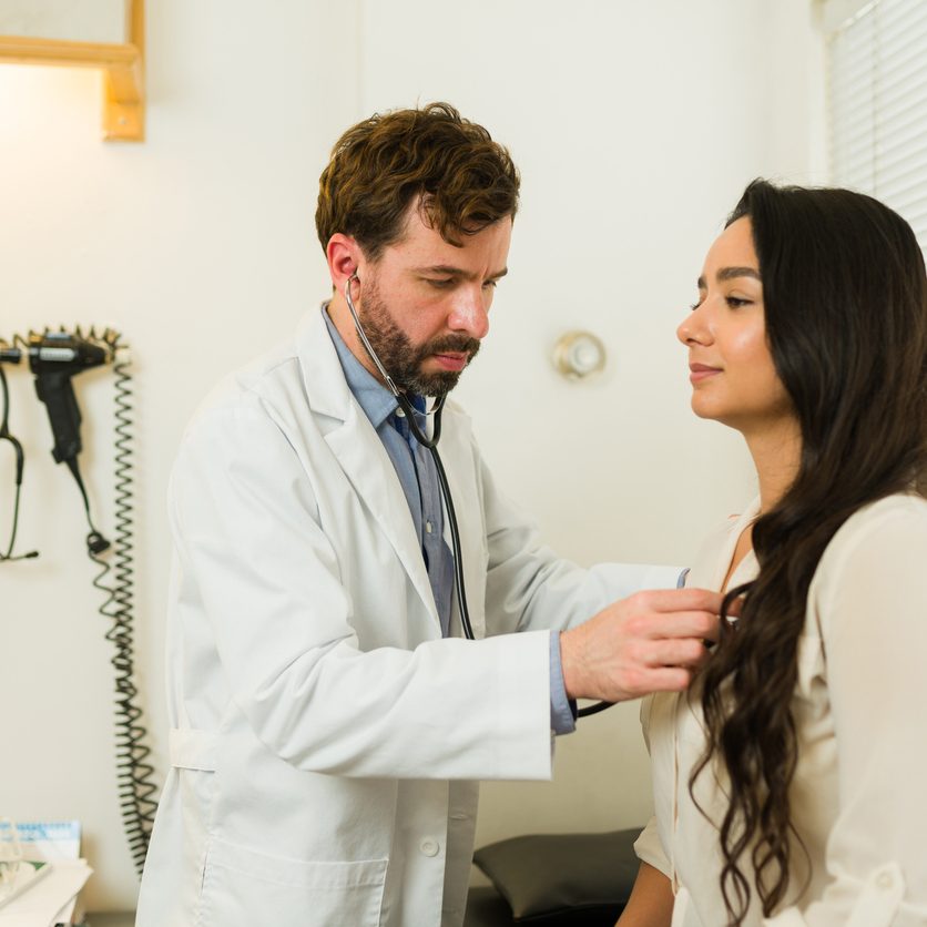 Attractive woman at the alternative health clinic going to the doctor's office for a medical check-up